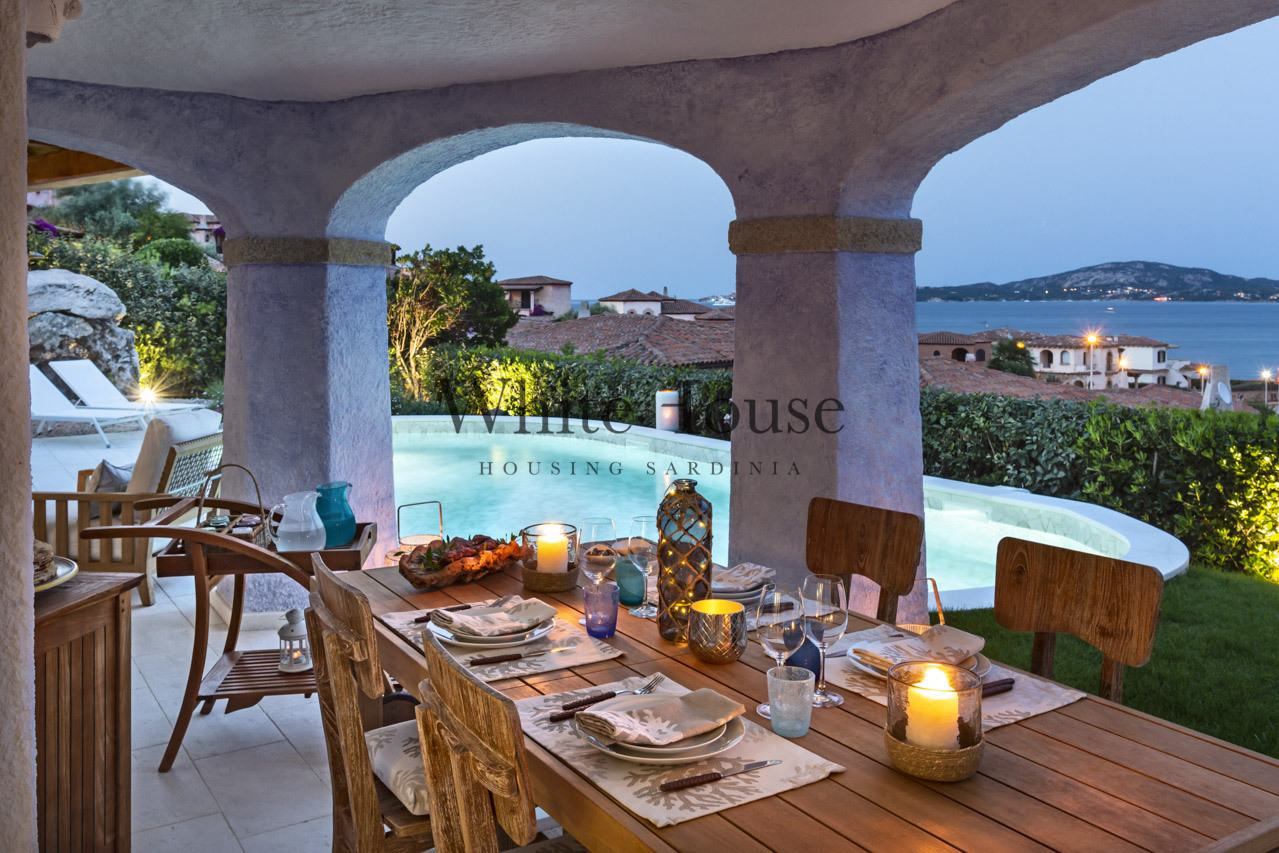 outdoor dining with sea and garden view